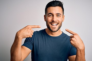 Patient in Tustin smiling with dental implants