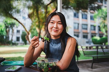 Patient in Tustin eating healthy with dental implants