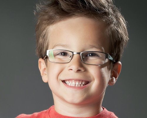 Young dental patient smiling after children's dentistry visit