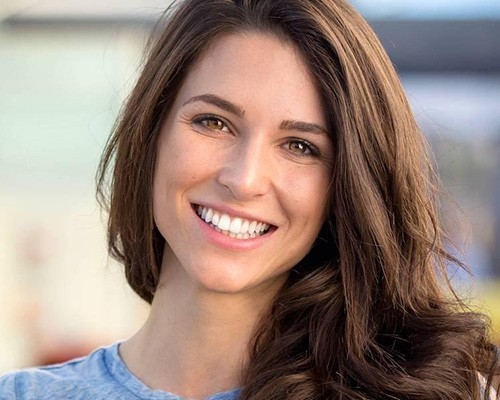 Woman sharing flawless smile after cosmetic dentistry