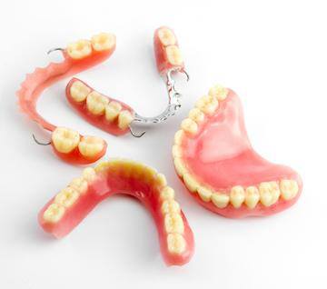 Four types of dentures on table