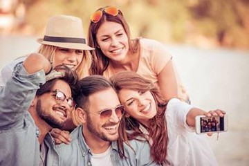 Family smiling after restoration with tooth colored fillings