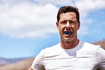 Tustin patient wearing athletic mouthguard 