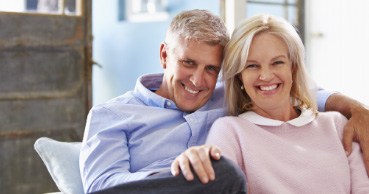 Man and woman with dentures smiling