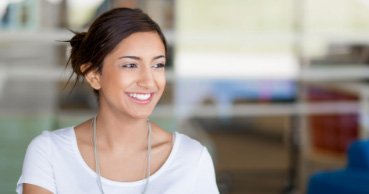 Woman smiling after tooth colored fillings