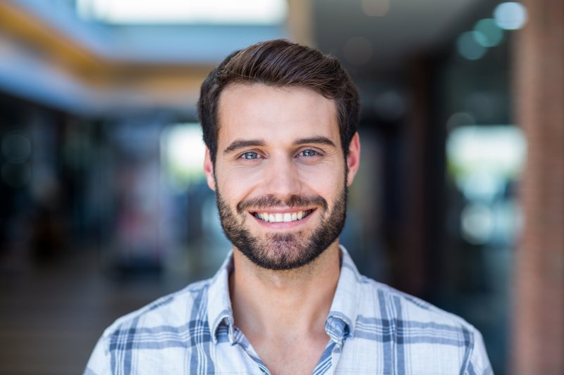 person smiling after having small teeth fixed